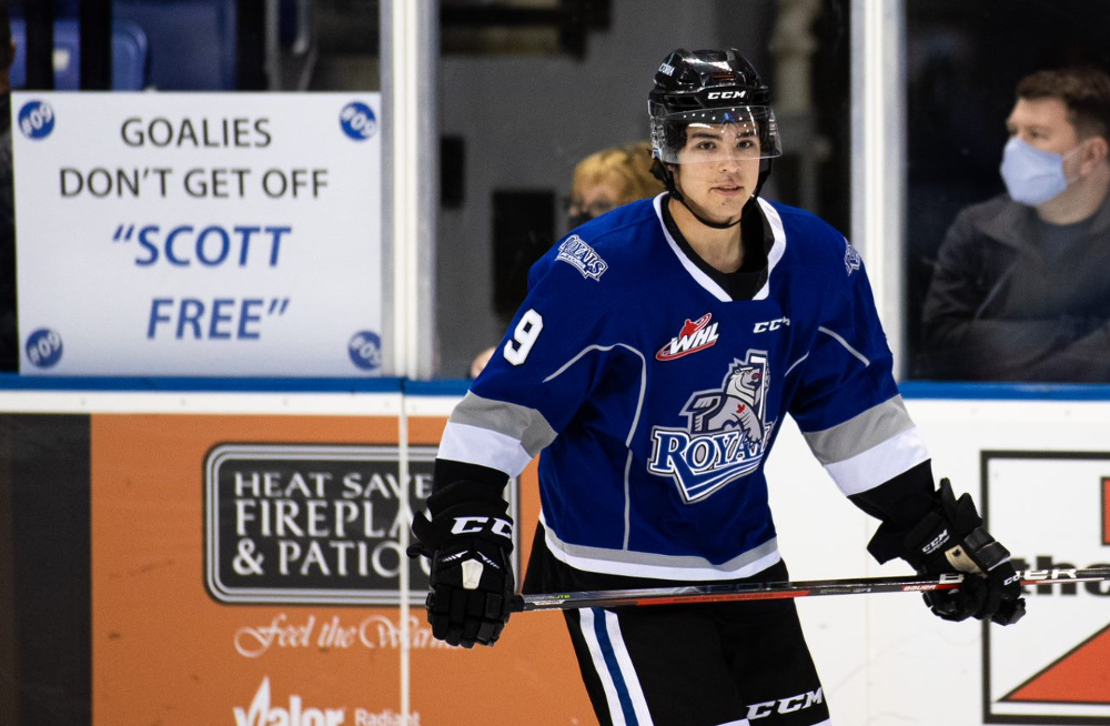 Tanner Scott of the Victoria Royals in front of a sign that reads "Goalies don't get off Scott Free"