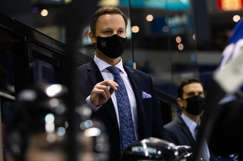 Dan Price behind the bench for the Victoria Royals early in the 2021-22 season
