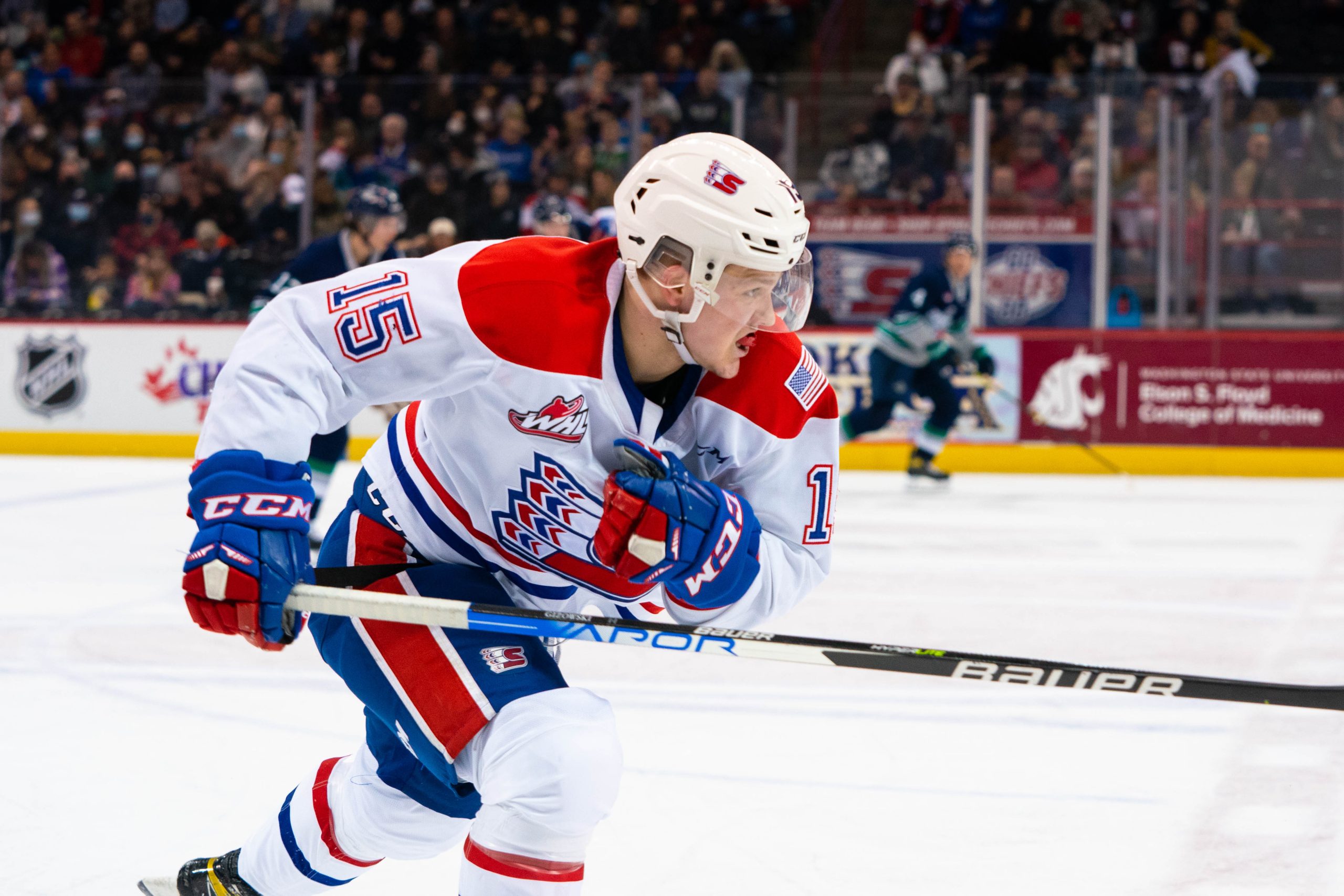 Kooper Gizowski of the Spokane Chiefs tracks down a puck