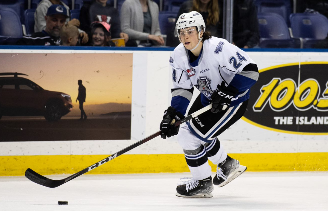 Victoria Royals defenceman Luke Shipley plays the puck