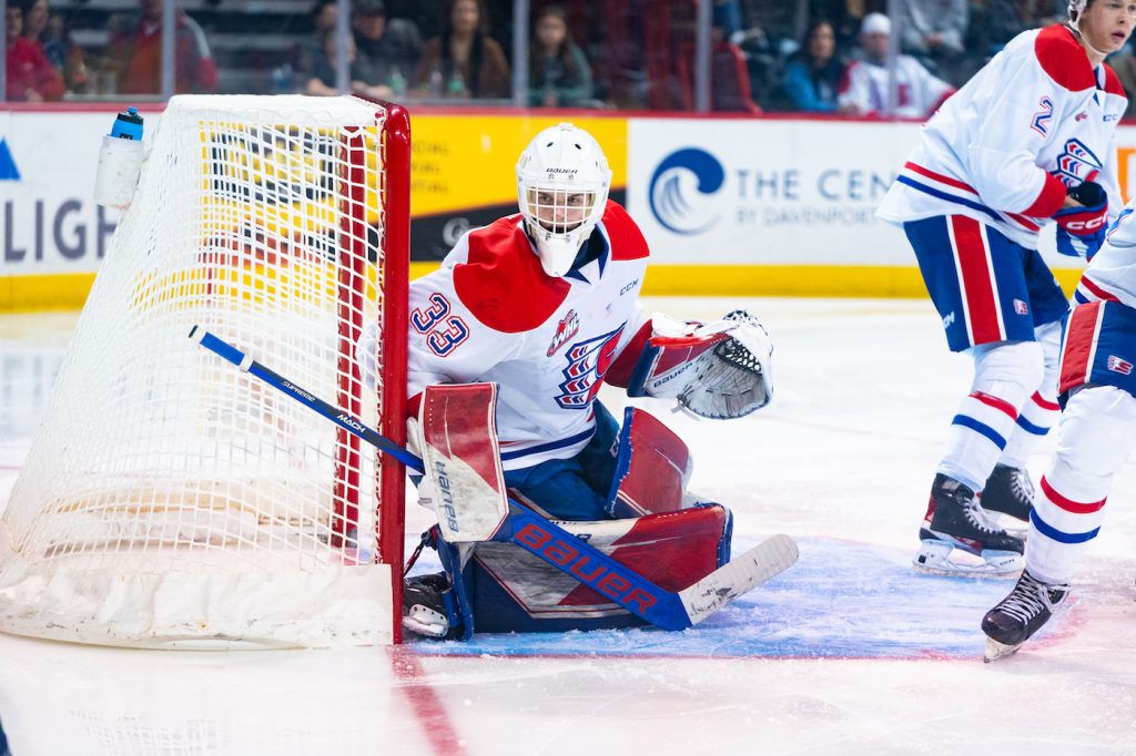 Spokane Chiefs goaltender Cooper Michaluk watches the puck from the net.