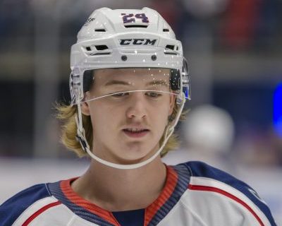 A profile shot of Tri-City Americans forward Deagan McMillan in the Americans' white jersey