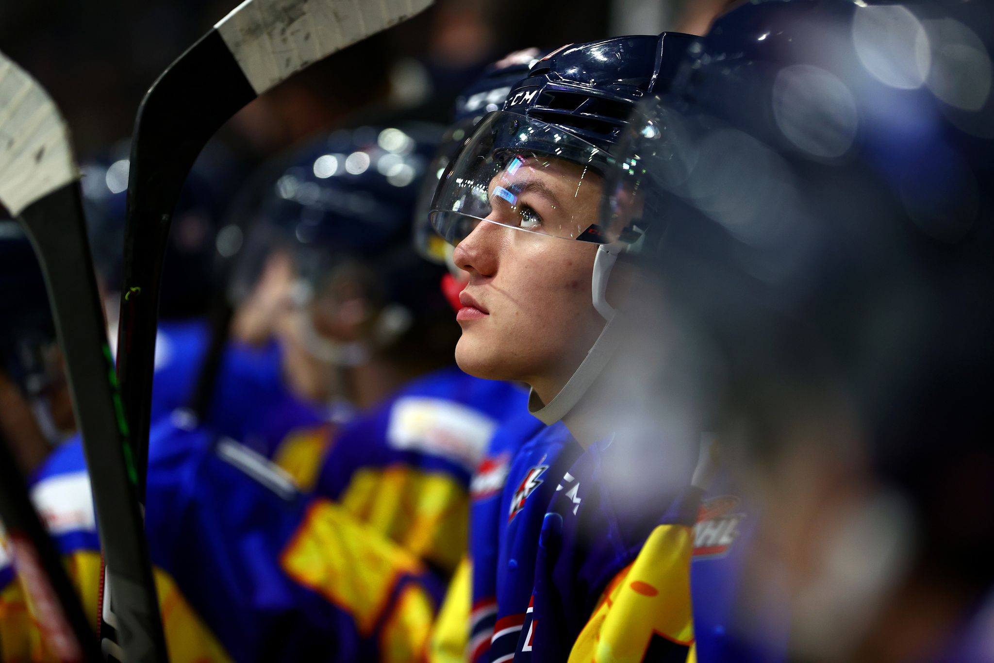 A side profile shot of Jaxsin Vaughan sitting on the bench.