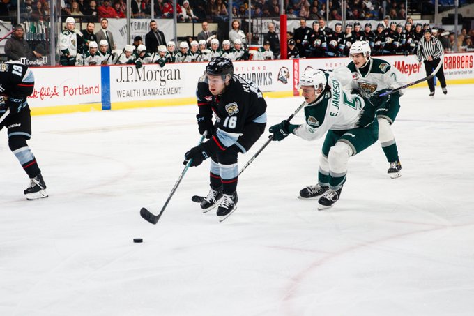 Gabe Klassen and Eric Jameison chase the puck in a hockey game. As the Winterhawks and Silvertips prepare for a second-round battle